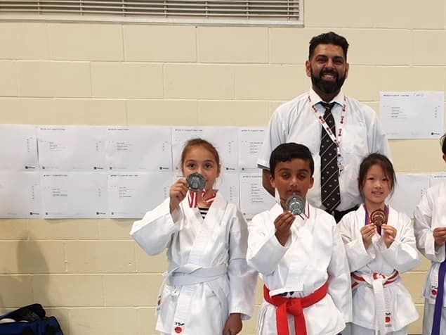Petr - Gold - Boys Brown and Black Belt Kumite 9-10 yrs
Petr - Gold - Boys Brown and Black Belt Kata 9-10 yrs 
Aisha - Silver - Girls Kumite 5-6 yrs
Sami - Silver Boys Kata - White to Red Belt
Gabriella - Silver - Girls Kata White to Red Belt
Zahra - Silver - Girls Kata Yellow to Purple Belt
Alex - Silver - Boys Kyu Grade Open Kata Under 16 yrs
Tavia - Bronze - Girls Kata White to Red Belt
Sensei Shyam - Bronze - 35+ Black Belt Men's Kata

Every member of the club that attended won a place on the podium. Fantastic result. 